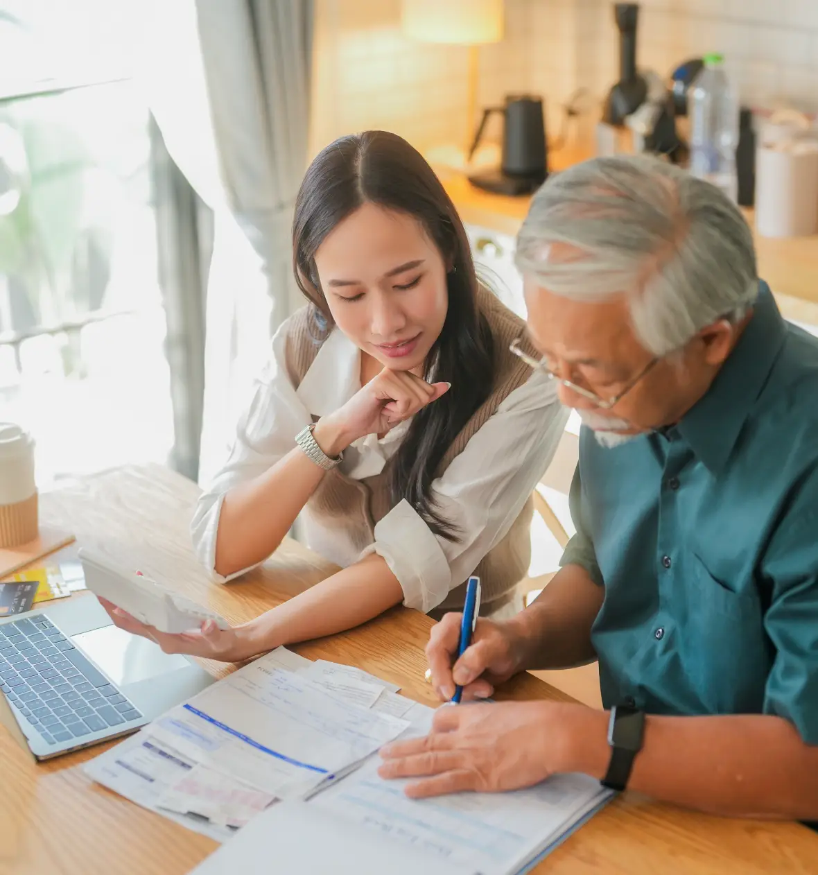 Daughter assists father with paperwork