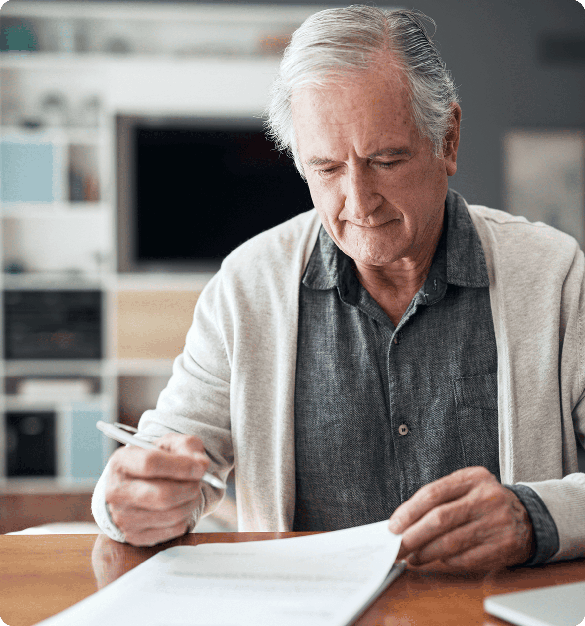 Elderly person reviewing paperwork