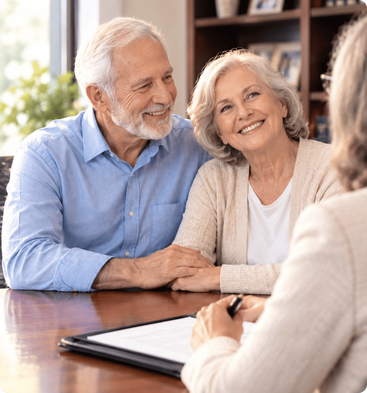 Happy senior couple meeting with financial advisor